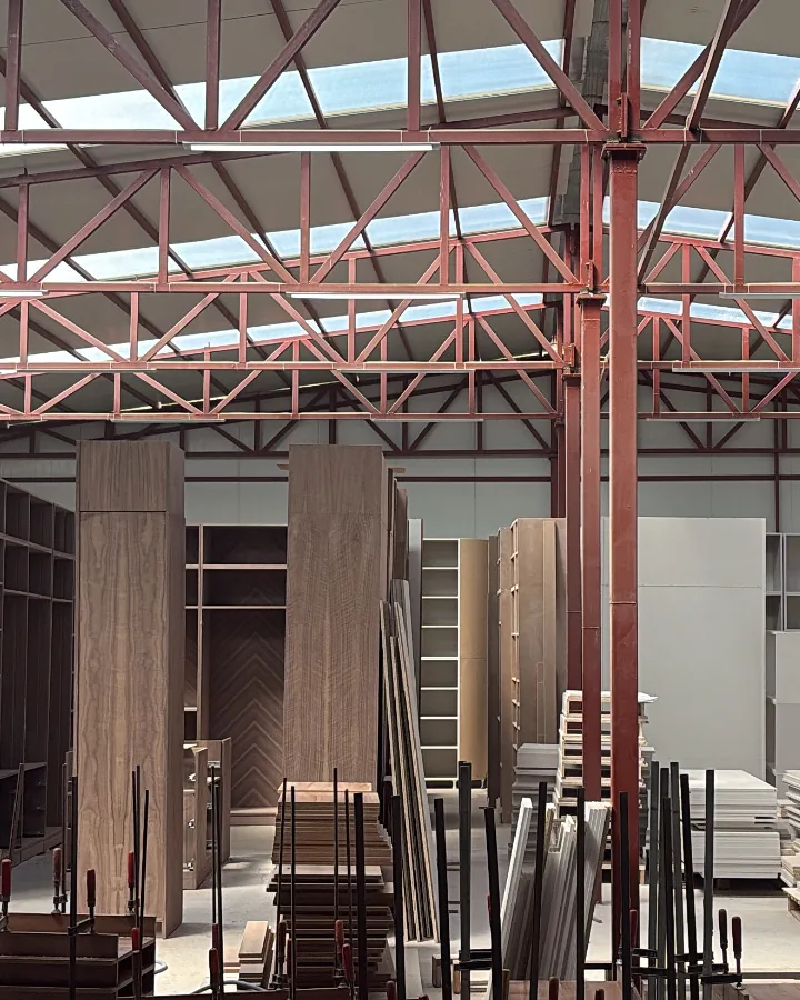 Walnut door sets and joinery in production on the DIM Mobilya workshop floor