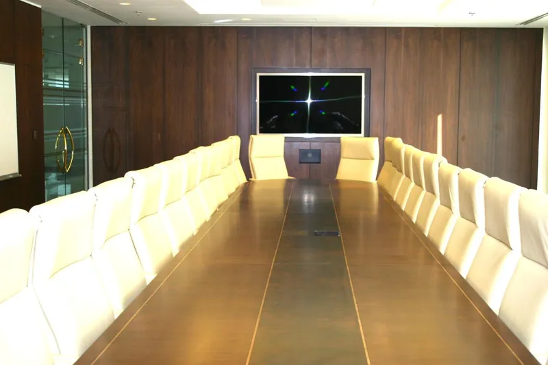 Executive boardroom with walnut conference table and wall monitor, Qatar Railways, Doha — DIM Mobilya