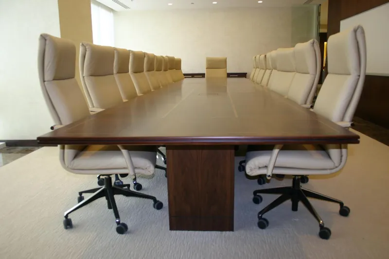 Boardroom with white leather chairs and veneered conference table, Qatar Railways, Doha — DIM Mobilya